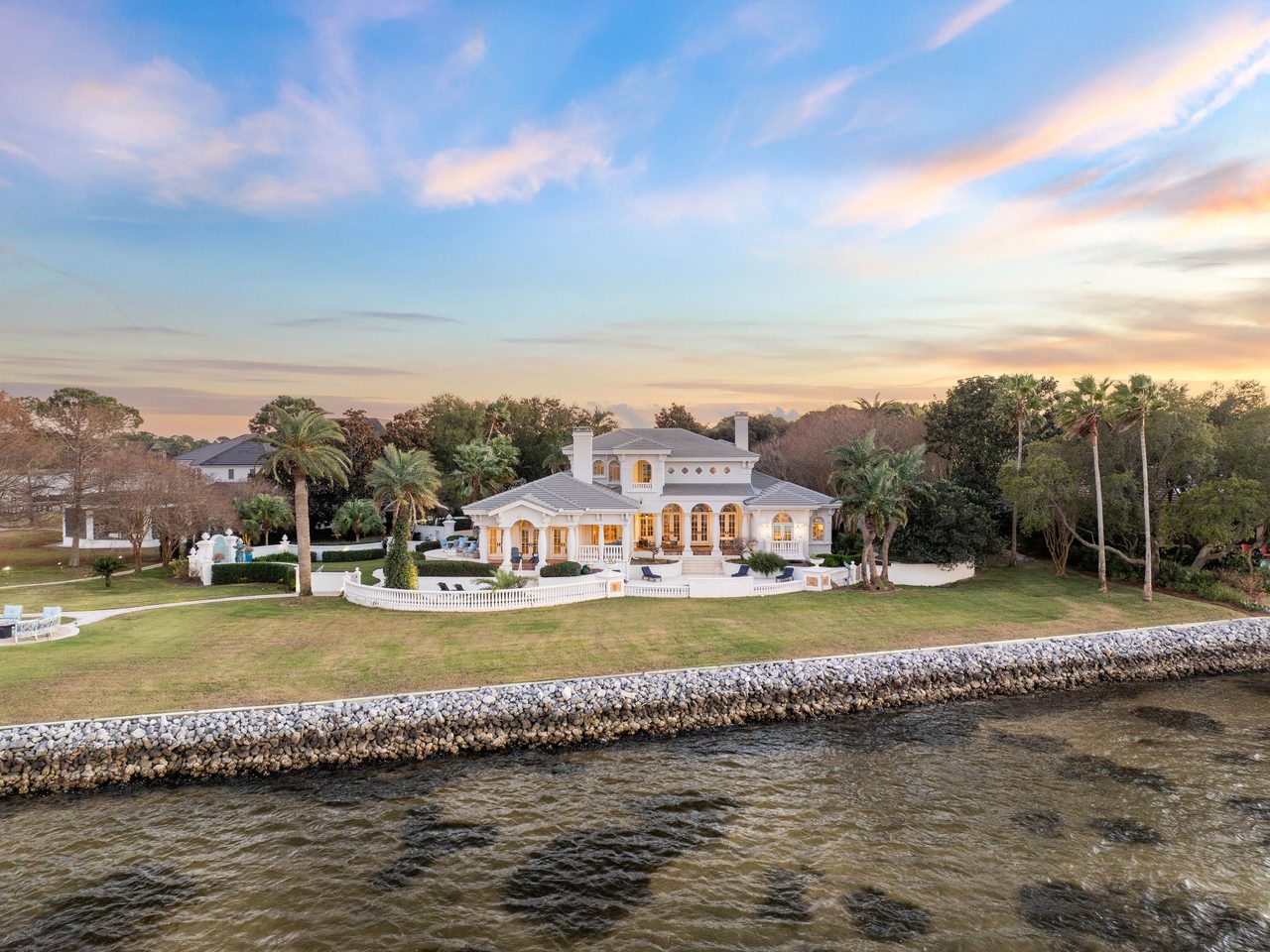 Waterfront Emerald Coast estate at sunset